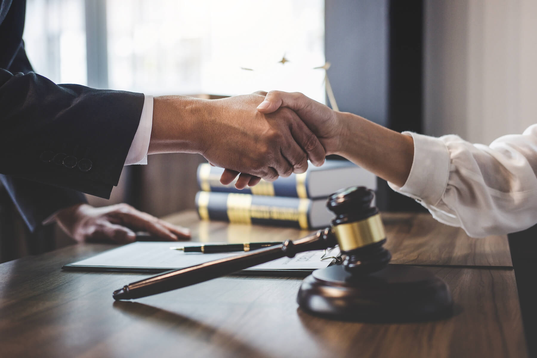 shaking hands at a law firm